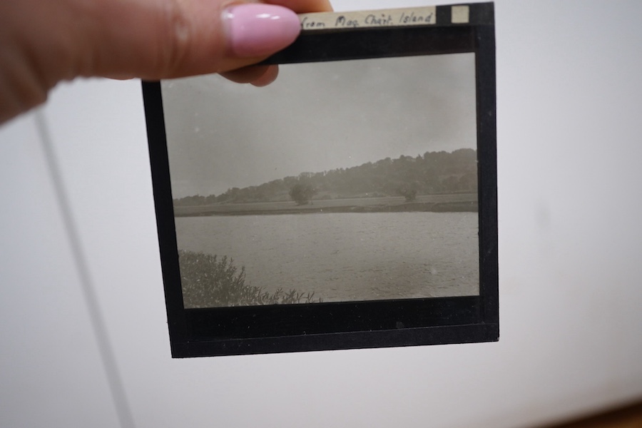 Two boxes of magic lantern slides to include Burnham Abbey and Windsor castle. Condition - fair